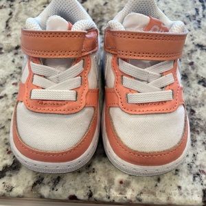 Brand NEW baby/toddler girl Nike sneakers size 3. Comes with original box.